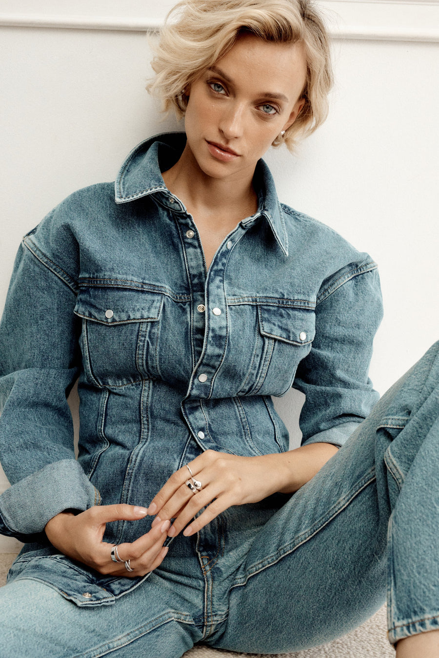 Model wearing denim and ESSENTIALS jewellery