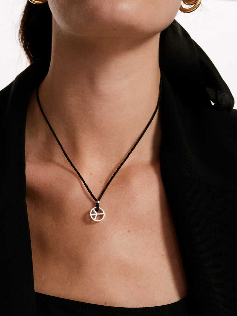  Black string necklace with a silver peace 1 