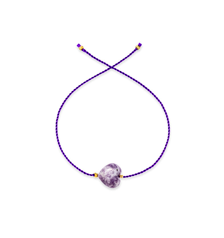  A bracelet on a purple string with a large purple heart 