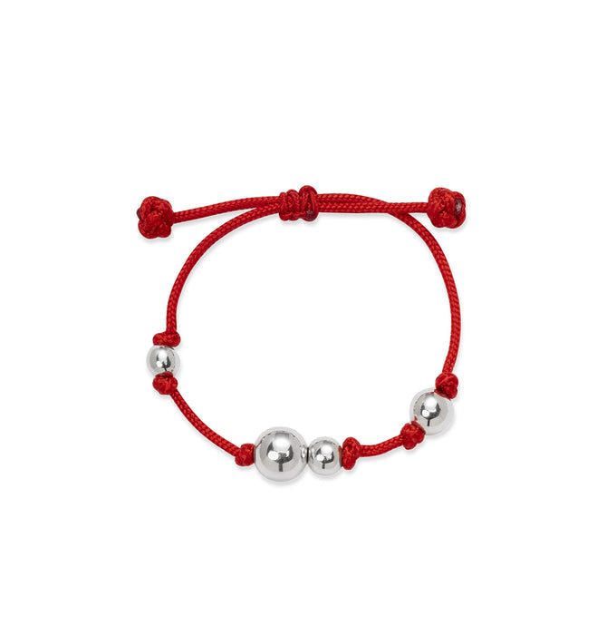 Czerwona bransoletka na sznurku ze srebrnymi kulkami 
