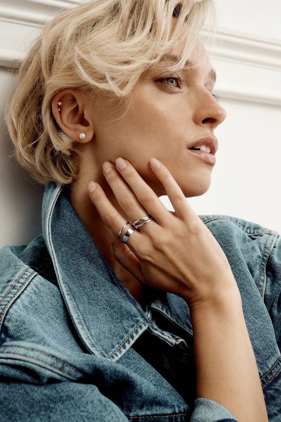 ESSENTIALS earrings and rings styled with denim
